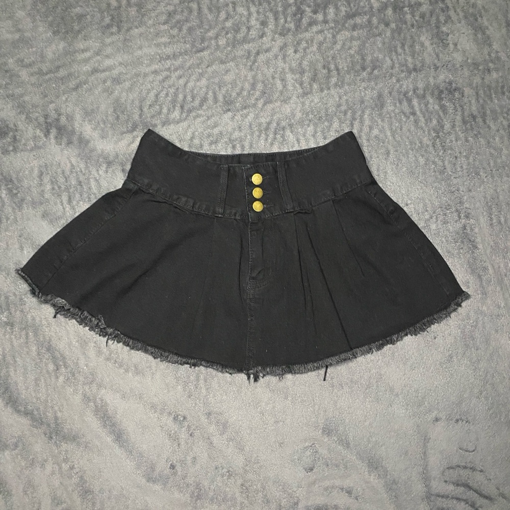 Black denim mini skirt with frayed hem and button detail